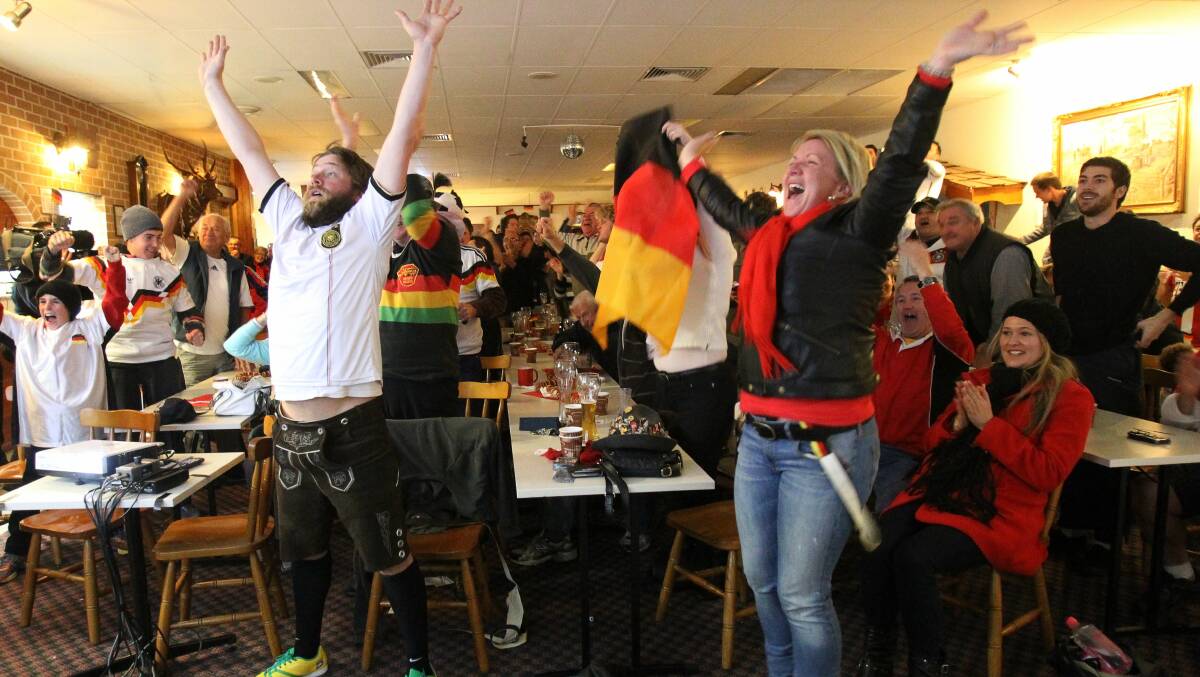 Joel and Elise Ward celebrate Germany's win at the German Club at Kembla Grange. Picture: GREG TOTMAN