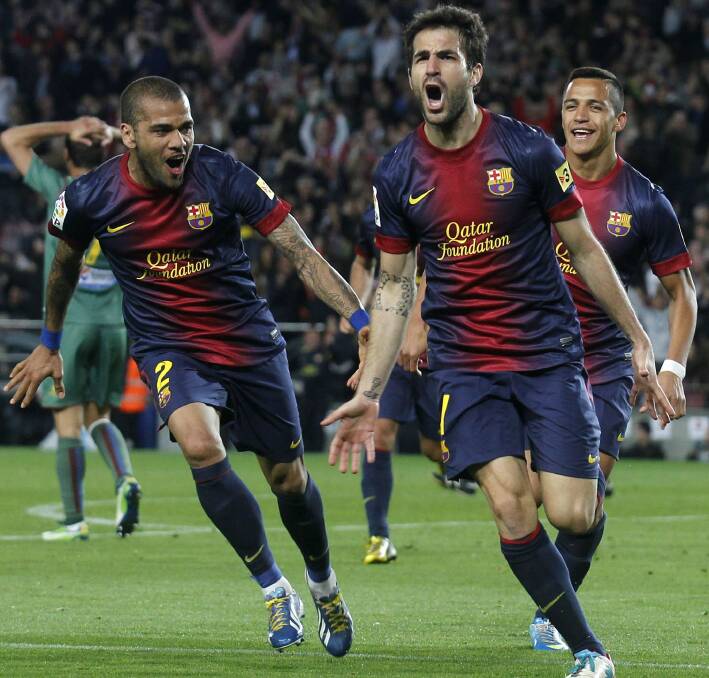 Barcelona's Dani Alves, Cesc Fabregas and Alexis Sanchez in Barcelona. Picture: REUTERS