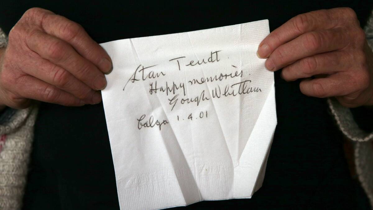 Suzanne Teudt who is daughter-in-law of Pat and Harry Teudt holds a napkin signed by Prime minister Gough Whitlam to her husband Stan Teudt. Picture: KIRK GILMOUR