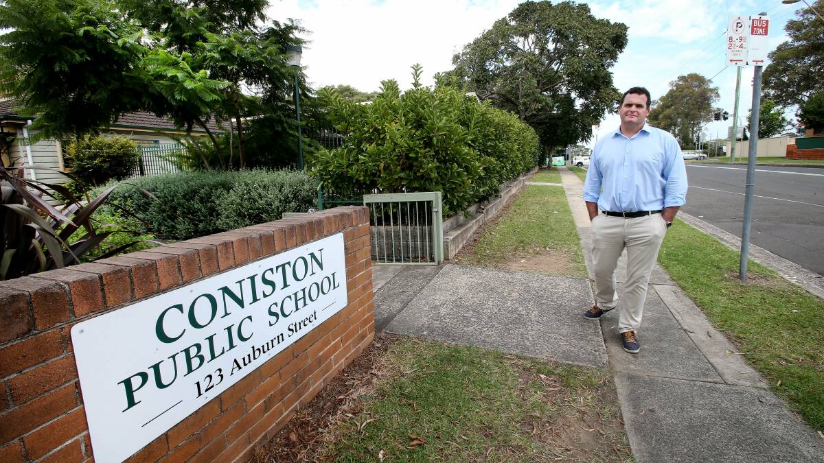 Coniston Public School P&C president Josh Brightman is worried that a planned expansion of a FACS building across the road from his school will affect the safety of students. Picture: KIRK GILMOUR
