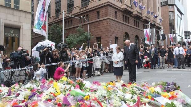 Governor-General of Australia Sir Peter Cosgrove pays his respects at Martin Place. Photo: Jennifer Polixenni
