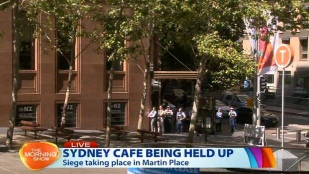 Police with guns drawn in Martin Place. Photo: Channel Seven