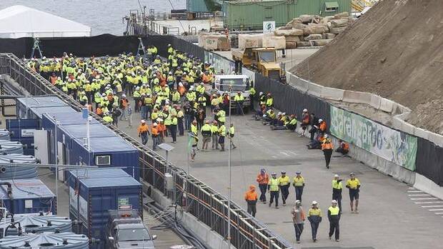 Construction workers leave the site. Picture: NICK MOIR
