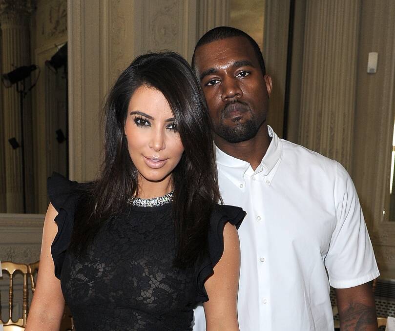 Kim Kardashian and Kanye West at the Valentino Haute-Couture show. Picture: GETTY IMAGES