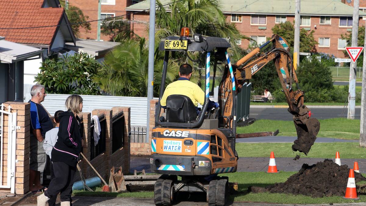 Three homes were flooded after a water main burst on Quarry Street, Port Kembla on Tuesday. Picture: KIRK GILMOUR