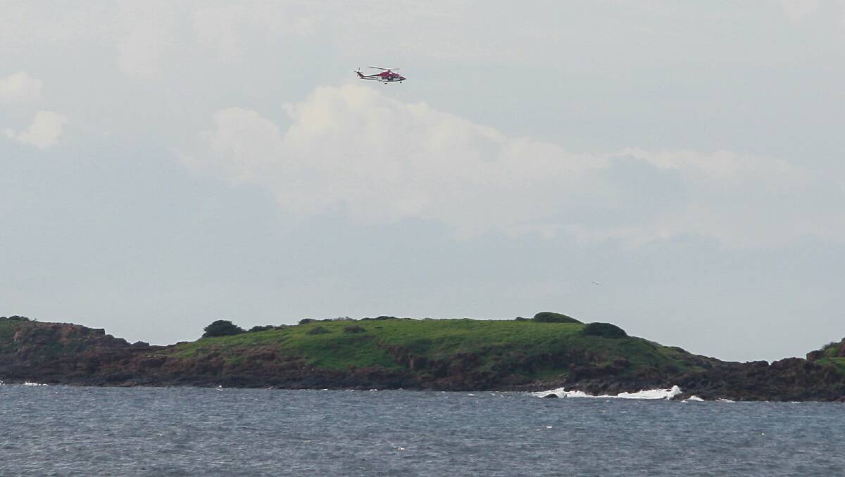 Three men were rescued after boat capsized near Port Kembla on Friday. Picture: CHRISTOPHER CHAN