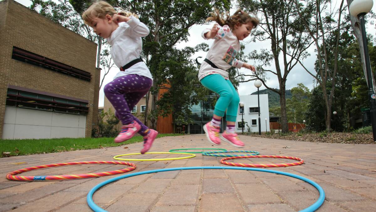 Physical activity monitors capture Mt St Thomas sisters Lucinda, 3, and Amelia Raso’s, 5, every movement. Picture: ADAM McLEAN