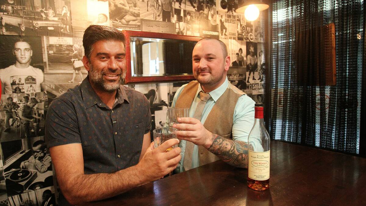 Howlin' Wolf Bar owner Manny Mavridis and bar manager Jay Cozma. Picture: GREG TOTMAN