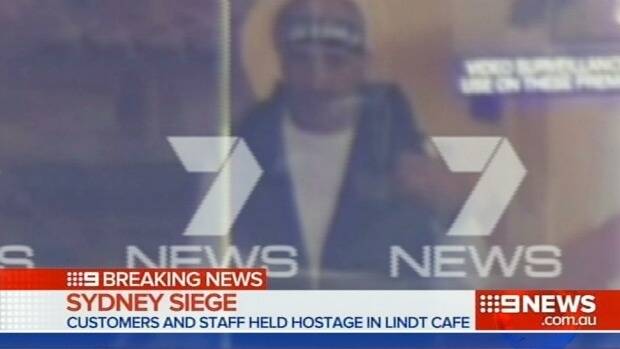 Martin Place Lindt Chocolat Cafe siege: drama continues overnight