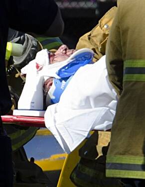 Paramedics attend to Harrison Ford, who was left with head injuries after the plane crash. Photo: Snapper Media