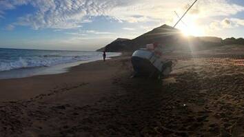 The yacht at Stanwell Park Beach at sunset on Sunday. Submitted picture.
