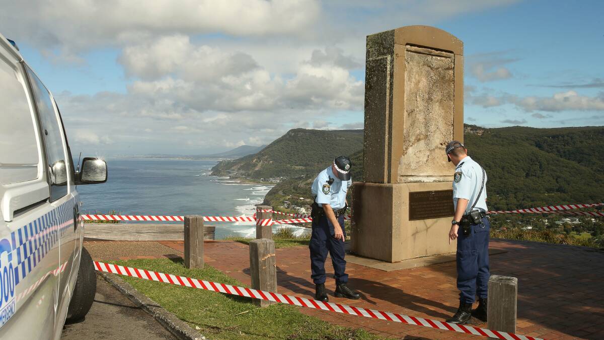 Wollongong Police assess the vandalised Lawrence Hargrave Monument. PICTURE: Kirk Gilmour

