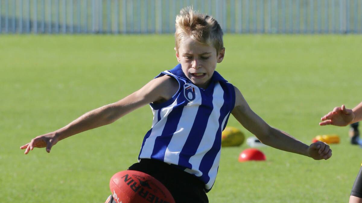 St Therese player Max Riolo shows his skills in the Paul Kelly Cup.
