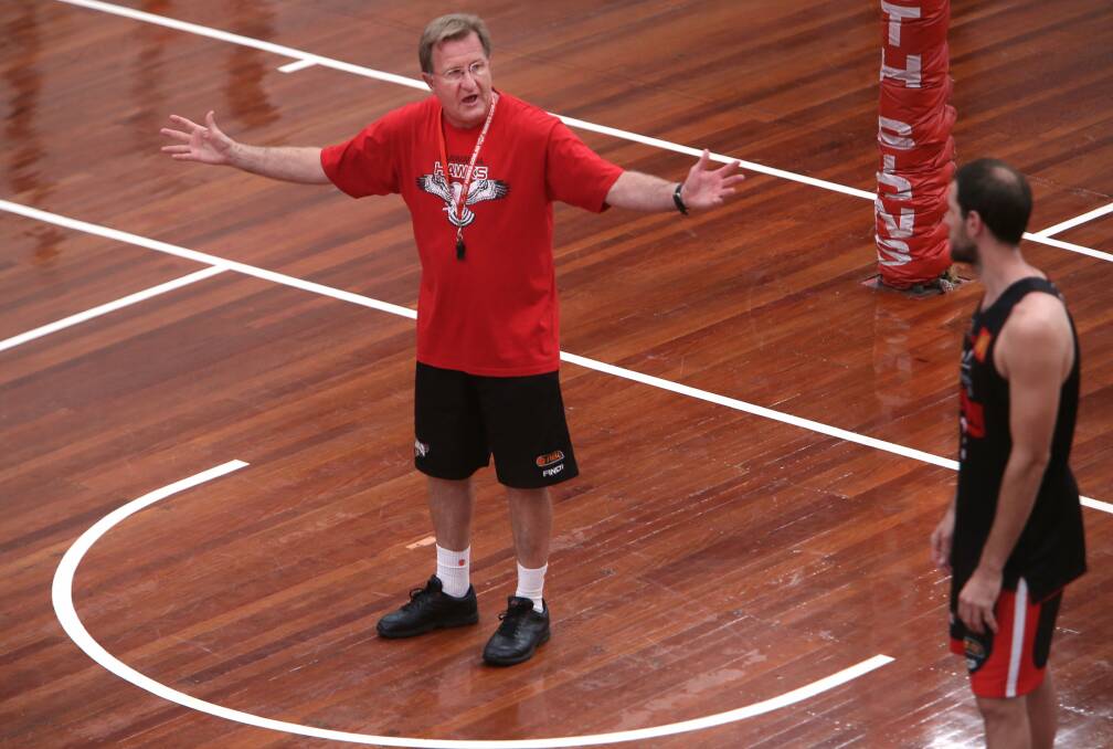 Hawks coach Gordie McLeod makes a point to guard Rhys Martin at training this week.