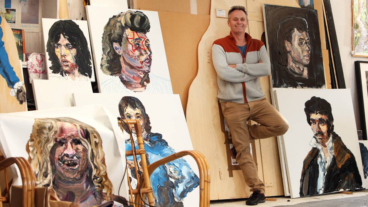 Archibald finalist Paul Ryan, from Thirroul with a painting of actor Richard Roxburgh. Picture: KIRK GILMOUR