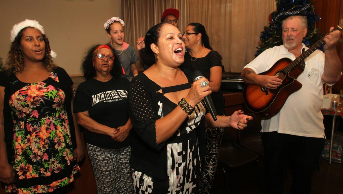 Popular singer and Coledale resident Christine Anu spreads Christmas cheer at the Wesley United Church lunch. Photo: Greg Totman.