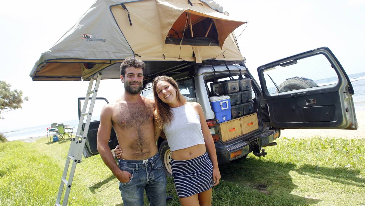 French backpackers Raphael Mizel and Charlotte Deslandre enjoying the free camping and facilities at the Austinmer boat ramp. Picture: ANDY ZAKELI