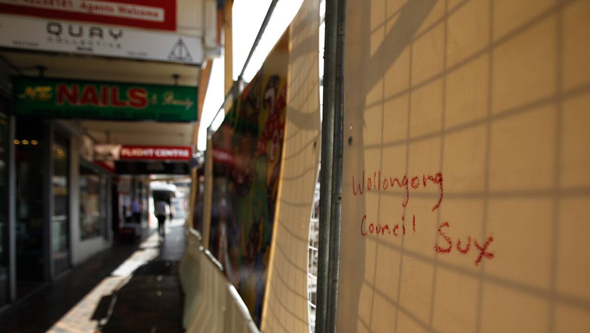Graffiti directed against Wollongong council on a construction fence in Crown St Mall in March. Picture: CHRISTOPHER CHAN