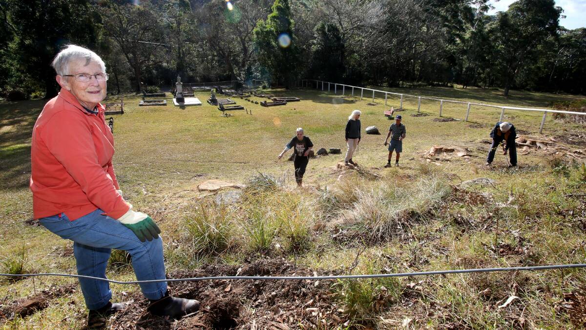Elizabeth Roberts  (front), Marion Beard, Jennifer Meharg, Col Meharg and Graham Bartholomew  digging holes at Windy Gully cemetery where trees will be planted for those who died in the Mt Kembla mine disaster of 1902. PIcture: KIRK GILMOUR