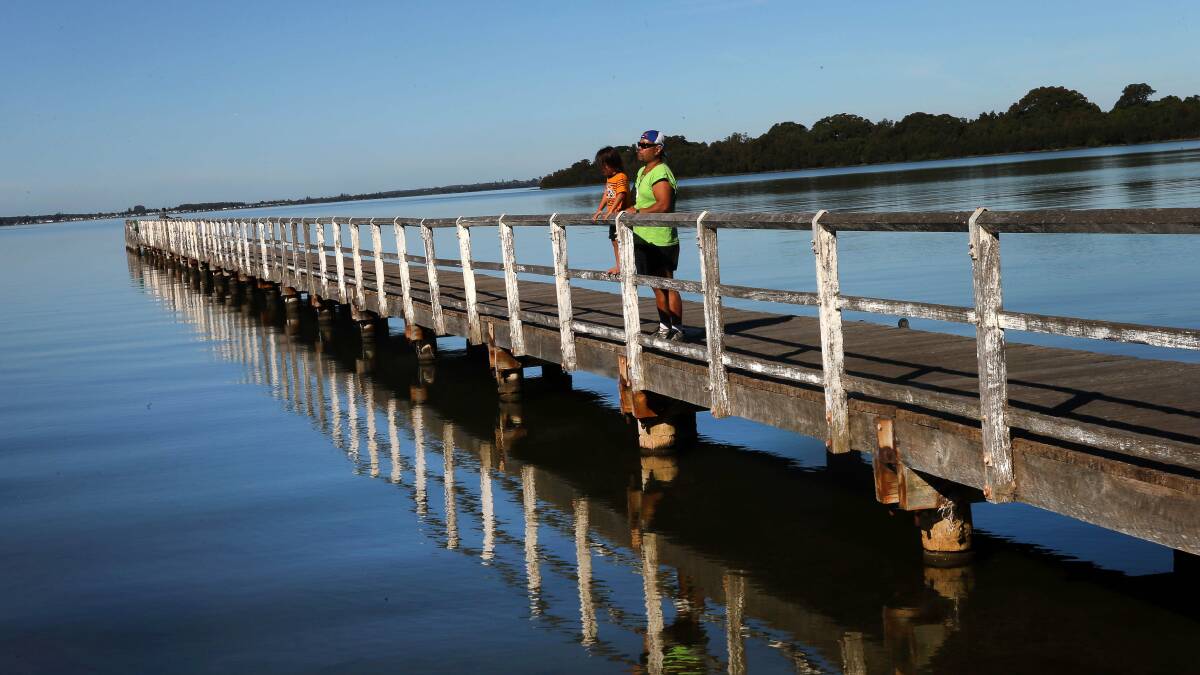 The calm waters of Lake Illawarra at Berkeley. There is still no committee set up to manage the lake. Picture: KIRK GILMOUR