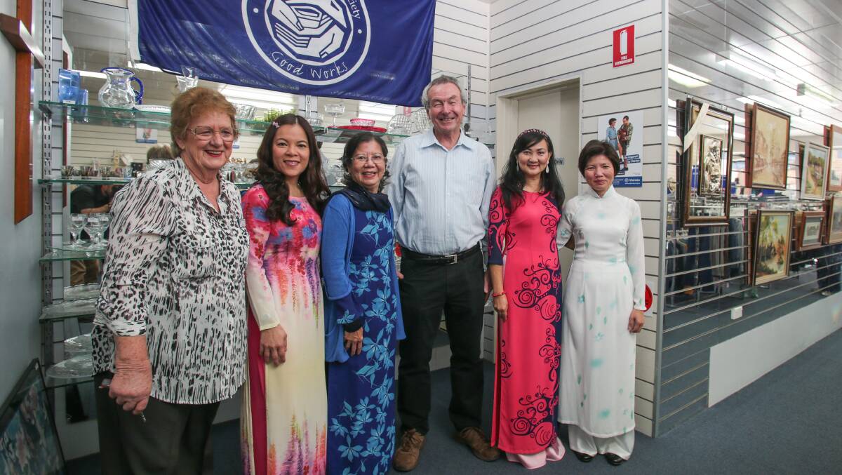 Edna Wilson, Teresa Tran, Quan Tran, Denis Walsh, Viet Do and Mai Nguyen celebrate the Vietnamese community's $17,000 donation to Vinnies for earthquake relief in Nepal. Picture: ADAM McLEAN