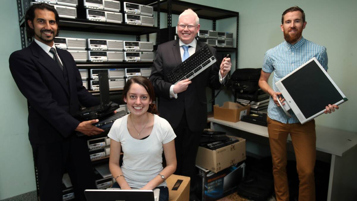 Paul Sabatier (Department of Communities), Emily Messieh (Thirroul Community Centre), Kiama MP Gareth Ward and Josh Hammond (Lighthouse Community Computers) with some of the free computers. Picture: KIRK GILMOUR