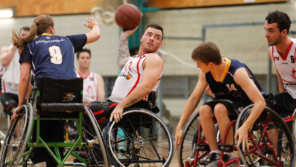 Luke Pople in action for the Wollongong Rollerhawks. The Horsley resident played for Australia at the world wheelchair basketball championships in South Korea, where the Australian Rollers defended the country’s 2010 title. Picture: CHRISTOPHER CHAN