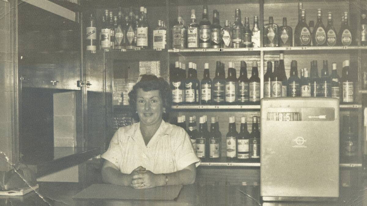 Doris Oxenbridge at the counter of the Hotel Charles’ first bottle shop in 1956. Picture: CAROL HERBEN