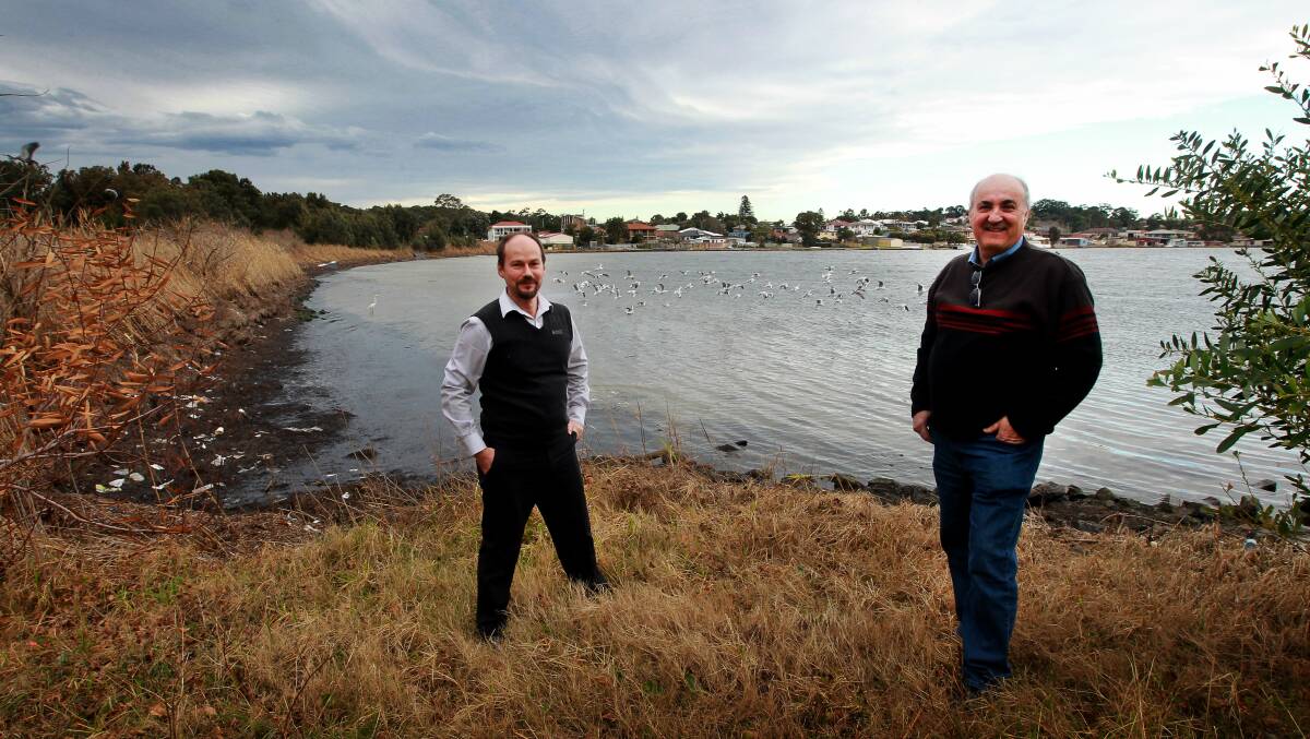 Kristian Williams and Anton Dominis want to build a second entrance at Lake Illawarra.  Picture: SYLVIA LIBER
