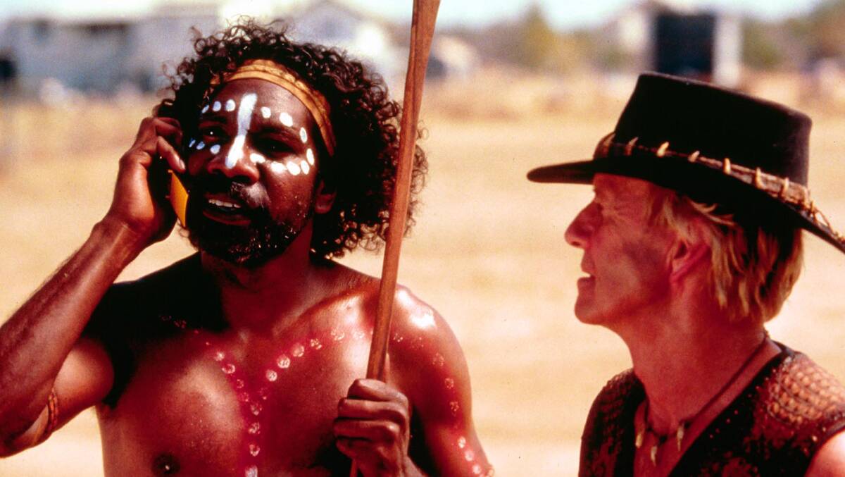 It's a long from from Walkabout Creek to LA: Paul Hogan, right, and David Ngoombujarra perform in a scene on the set of the film 'Crocodile Dundee in Los Angeles'