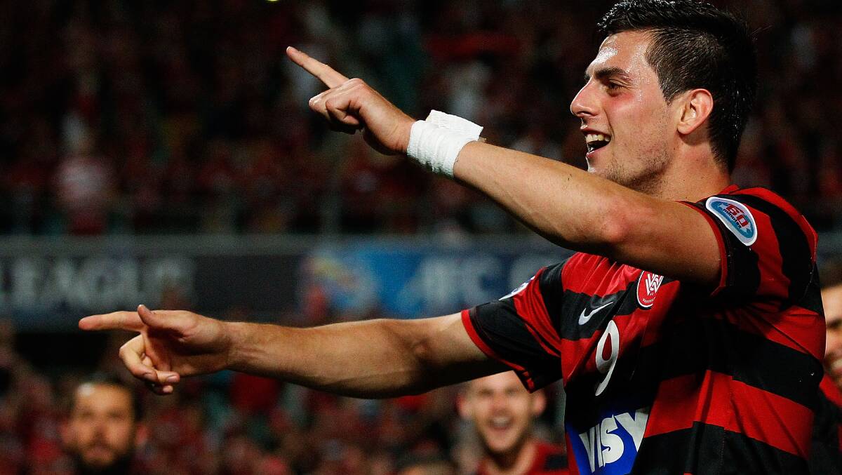 Goal: Tomi Juric celebrates scoring for the Wanderers at Pirtek Stadium. Picture: GETTY IMAGES