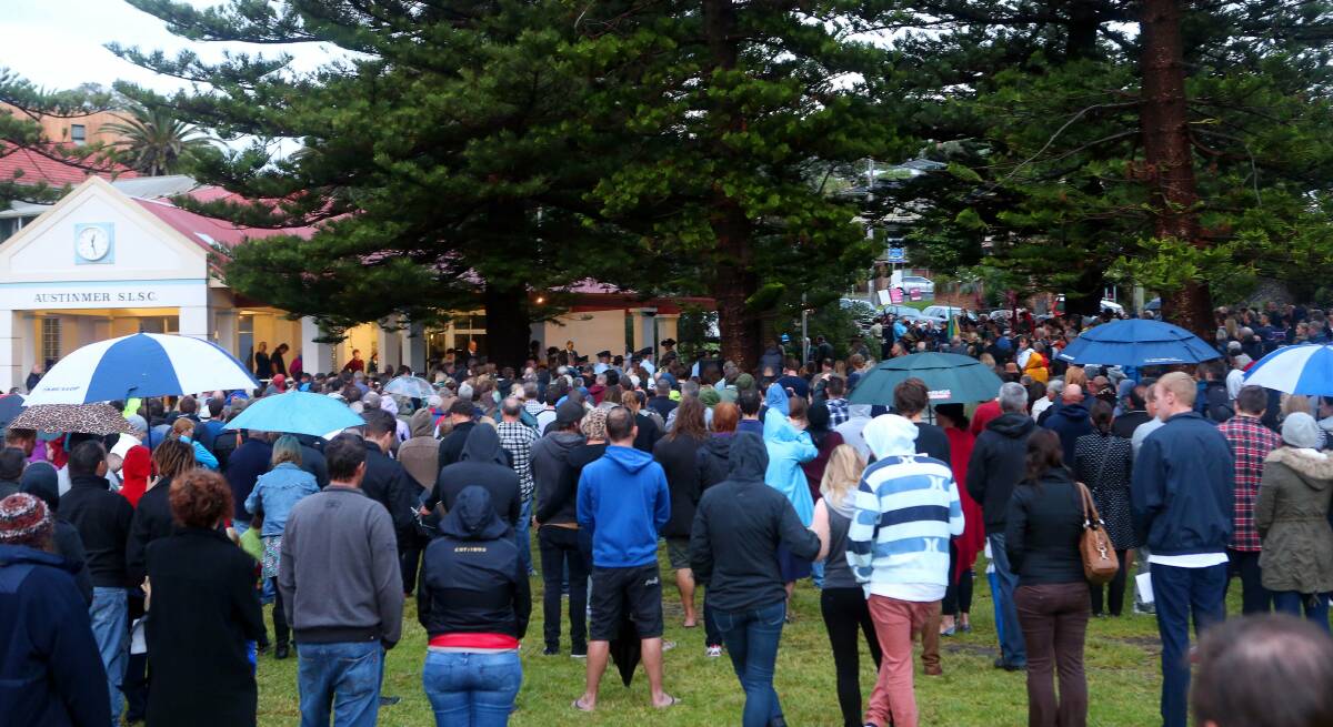A crowd at the Austinmer Memorial paying their respects during the Austinmer ANZAC Day Dawn Service. Picture: KIRK GILMOUR