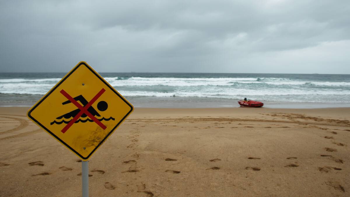Fairy Meadow Beach was closed while patrol boats searched the waters. Picture: CHRISTOPHER CHAN