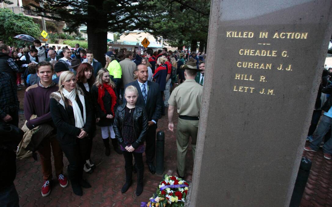 Rob Cheadle at the Austinmer Memorial to pay their respects at the Austinmer ANZAC Day Dawn Service. Picture: KIRK GILMOUR