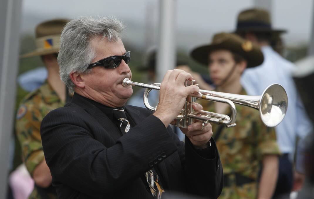 Neil Lendrum plays the Last Post at the Shellharbour morning service. Picture: ANDY ZAKELI
