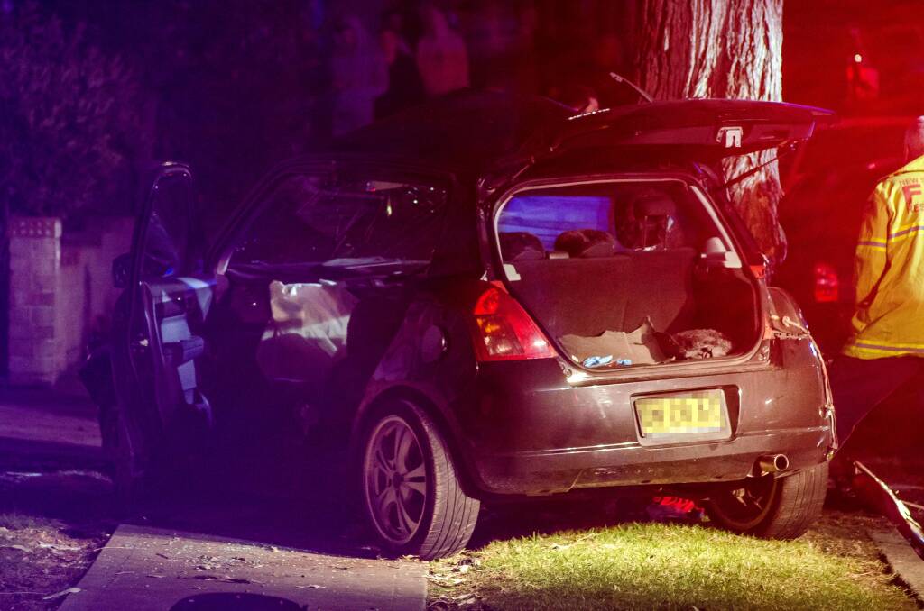 The scene of a single car accident at Boollwarroo Parade, Shellharbour last night. Picture: LUKE LAMMERS