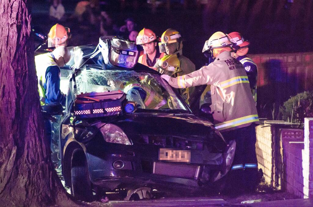 The scene of a single car accident at Boollwarroo Parade, Shellharbour Thursday night. Picture: LUKE LAMMERS