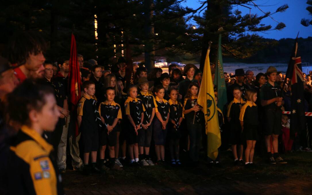 A crowd at the Austinmer Memorial paying their respects during the Austinmer ANZAC Day Dawn Service. Picture: KIRK GILMOUR