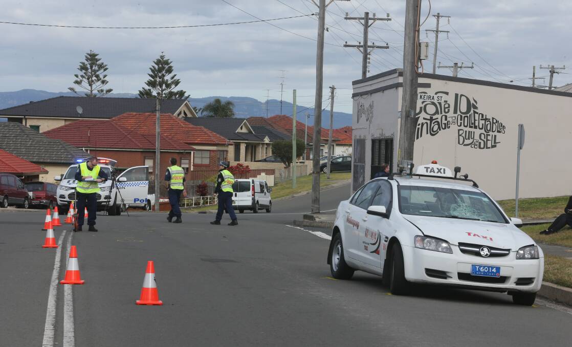 Police attend the scene where an elderly man was hit by a taxi near the corner of Keira and Illawarra streets Port Kembla. Picture: ROBERT PEET