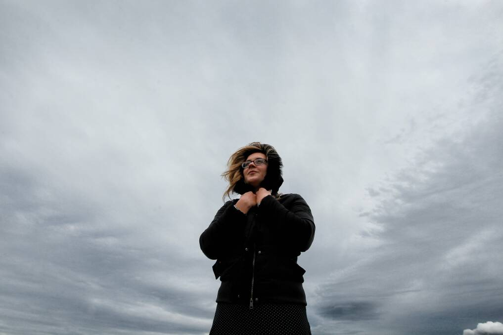 Ashleigh Morton at Flagstaff Hill Wollongong during a windy day. Picture: SYLVIA LIBER