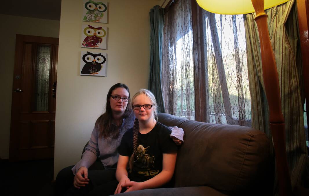 Sophie Mason with her daughter, Faith, who has been the target of attacks by neighbourhood bullies. Picture: ADAM McLEAN