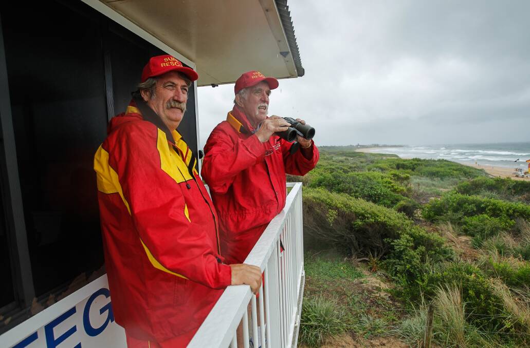 Steven Tresidder and Lawrence Loubond patrol Fairy Meadow beach. Picture: CHRISTOPHER CHAN