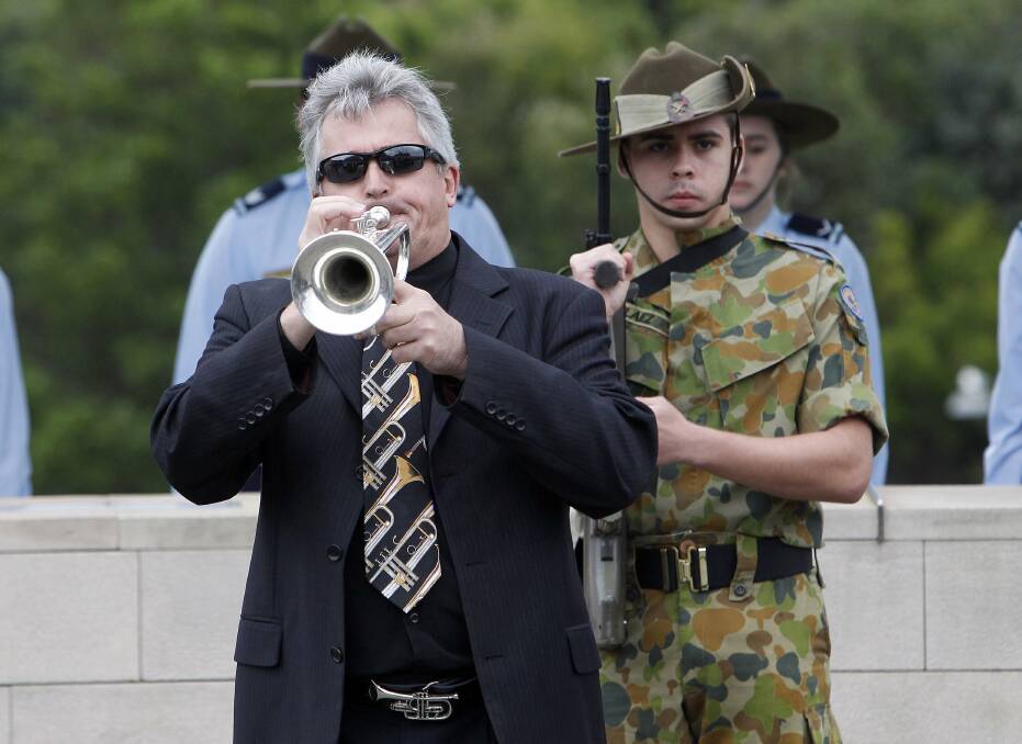 Neil Lendrum plays the Last post at the Shellharbour morning service. Picture: ANDY ZAKELI