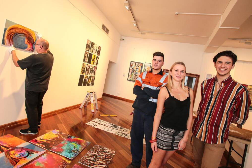 Matt Liberante, Grace Stovin-Bradford and Jake Kuit with artworks that's part of the art express exhibition at Wollongong City gallery. Picture: ADAM McLEAN