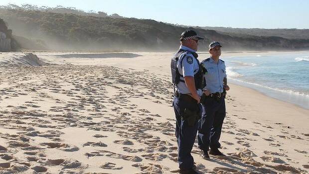 Police at Terrace Beach Monday afternoon where a ten-year-old boy died after a sand dune collapsed on him. Picture: AMANDA STROUD