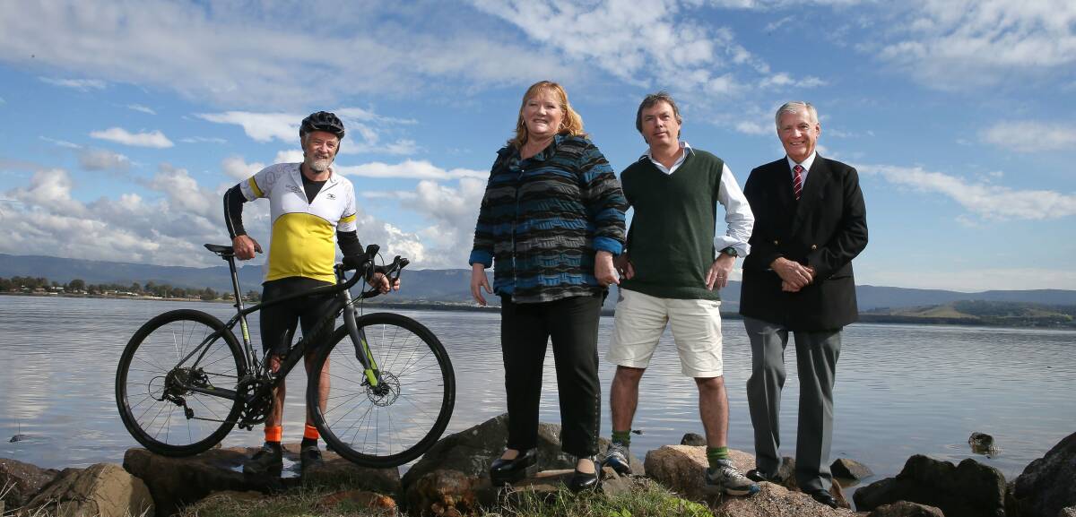 Shellharbour Mayor Marianne Saliba, Wollongong’s  Cr  George Takacs and Kiama Mayor Brian Petschler  take note of how happy Illawarra Bicycle Users Group’s  Werner Steyer looks. Picture: KIRK GILMOUR