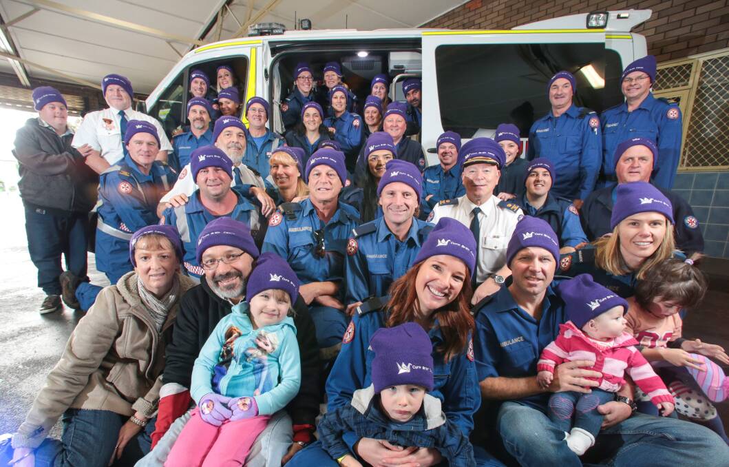 Wollongong ambulance personnel have taken up the challenge to buy and wear purple beanies to help raise funds against brain cancer. Picture: ADAM McLEAN