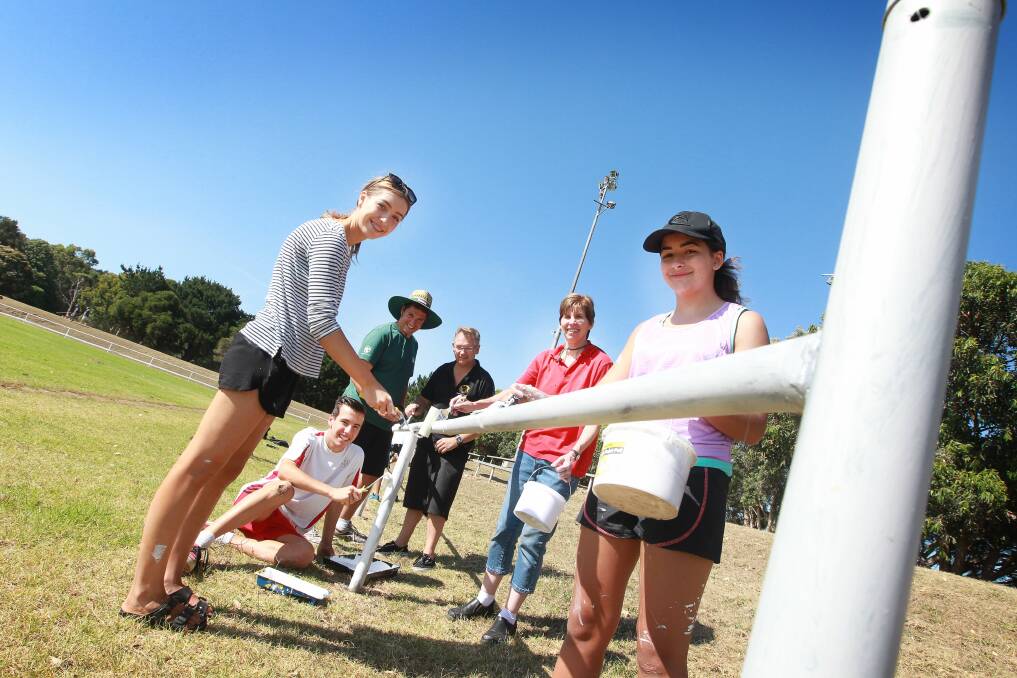 Bunnings Warehouse staff assisted in sprucing up Coniston’s soccer field. Picture: SYLVIA LIBER