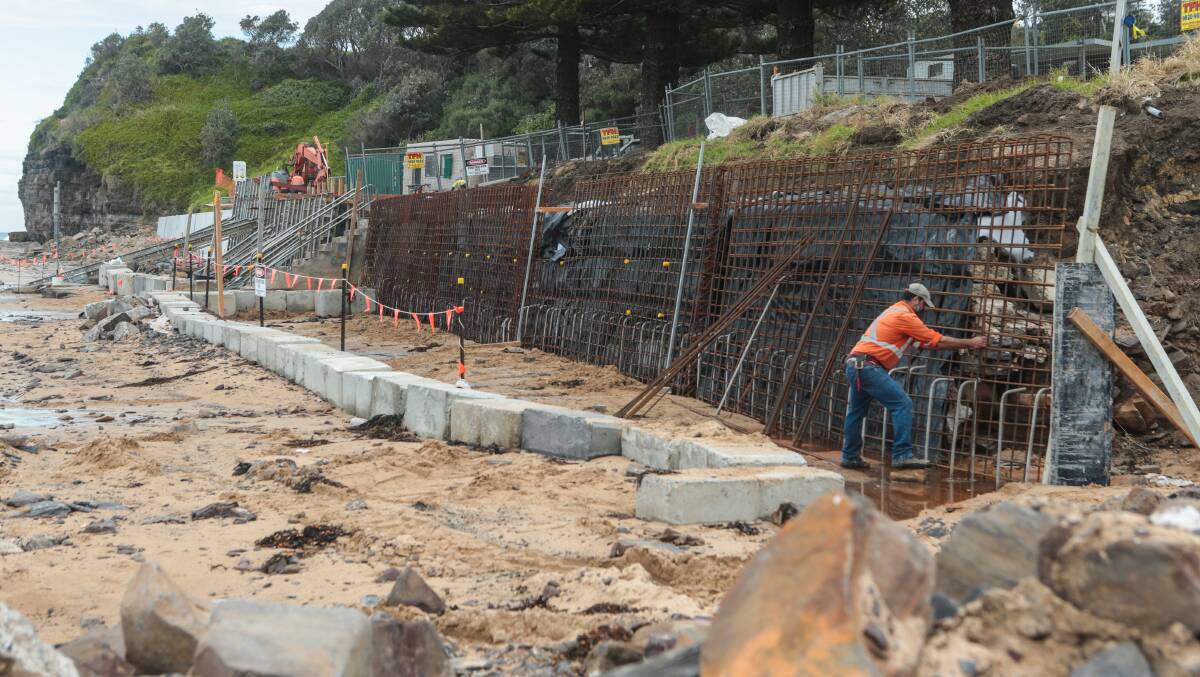 Work on the Wombarra sea wall being undertaken on Friday. Picture: ADAM McLEAN. 
