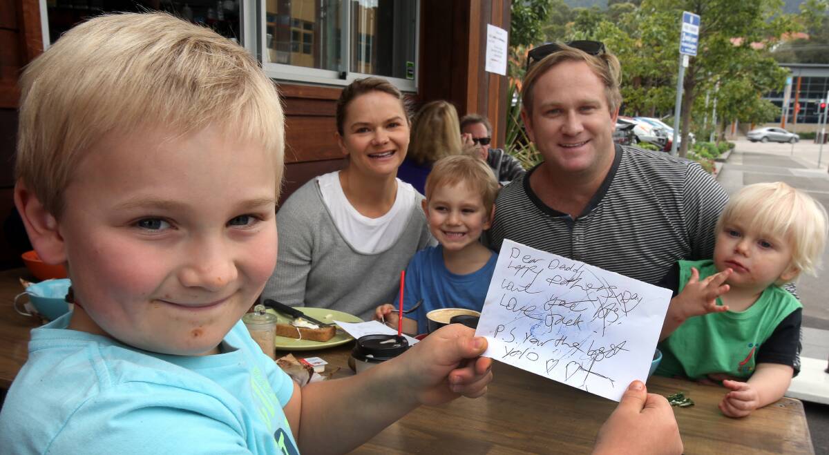 Jack Squires, 8, Emily Squires, Charlie Squires, 5, Jason Squires and Oscar Squires, 2, enjoying Father’s Day breakfast at Seafoam Cafe, Thirroul. Picture: ROBERT PEET